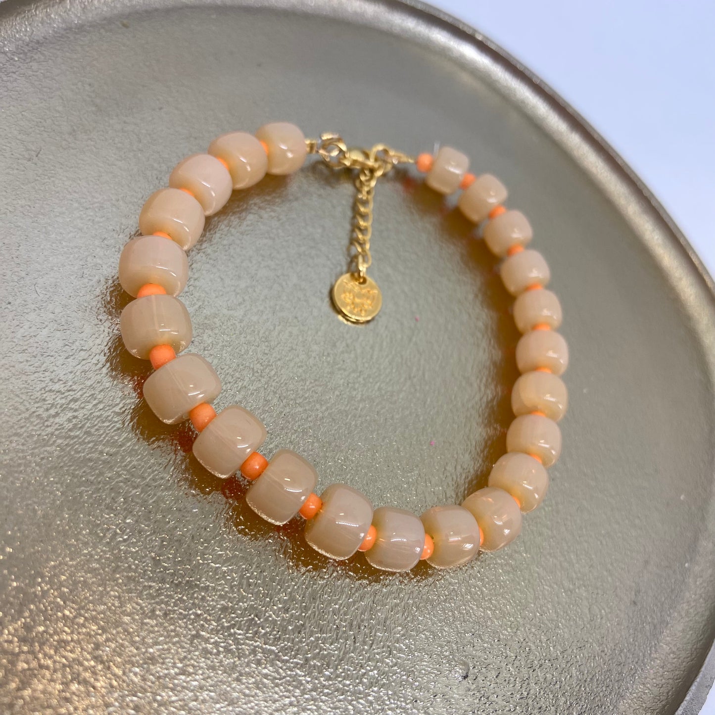 Armband: rondellen (licht oranje)