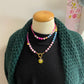 Kralenketting (roze) met bloem