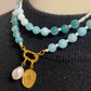 Kralenketting (groen) met 2 bedels